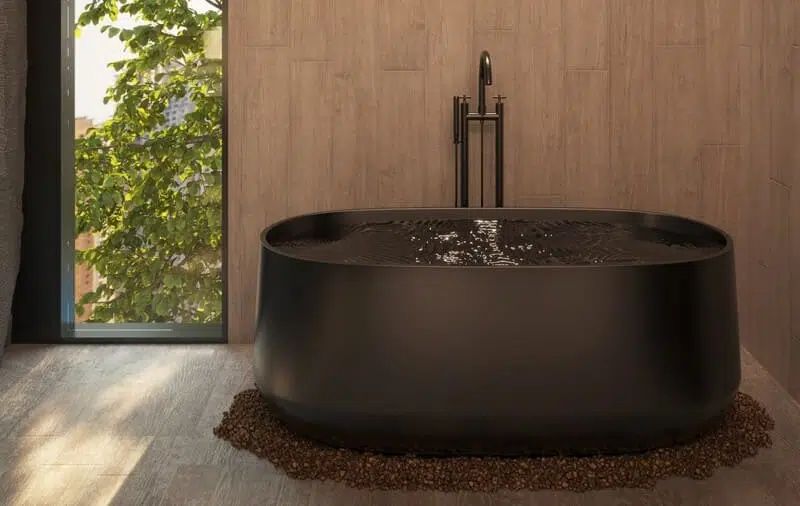 freestanding bathtub in a small bathroom