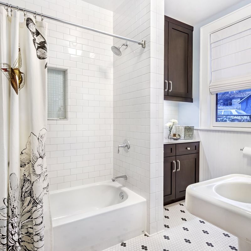 small bathtub and hexagonal floor tile