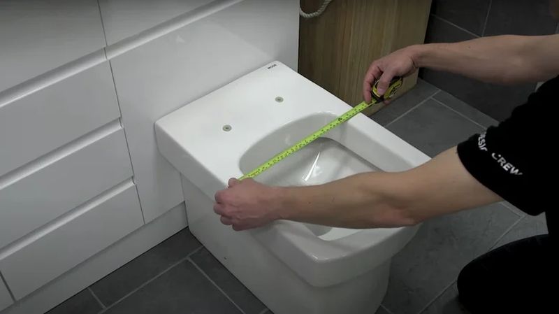 measure for a toilet seat bowl width